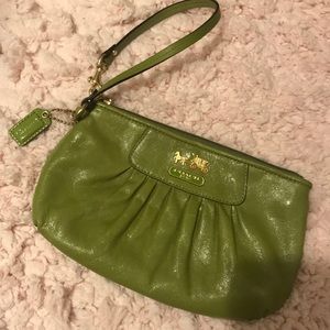 Olive colored Coach wristlet